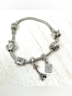 PANDORA  “travel” themed 6 charm sterling silver bracelet
